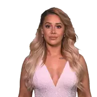 a woman in a white dress has a tattoo on her chest that says ' pride ' on it
