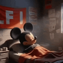 mickey mouse is laying in a bed with his eyes closed in a room .