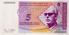 a five dollar bill with a picture of a man wearing sunglasses