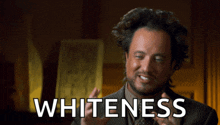 a man in a suit and tie says " whiteness " in white letters