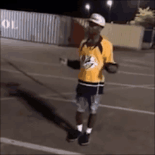 a man is jumping a rope in a parking lot