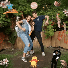 a man and woman are dancing in front of a bamboo fence with a winnie the pooh cartoon in the foreground