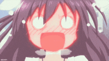a close up of a girl with a surprised look on her face .