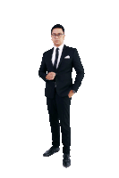 a man in a suit and tie with his hand in his pocket