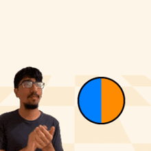 a man wearing glasses is clapping in front of a sign that says lazer + splodey lazersplode
