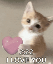 a kitten holding a pink heart with the words 2:22 i love you below it