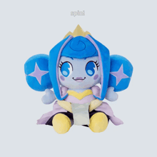 a blue and purple stuffed animal with the words spin on the bottom right