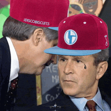 a man wearing a red hat with discobiscuits on it