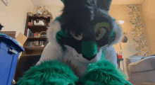 a person in a furry costume is sitting in a room