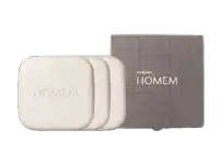 a box of natura homem soap sits next to two bars of soap