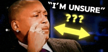a man in a suit and tie says " i 'm unsure " with a yellow arrow pointing to the right