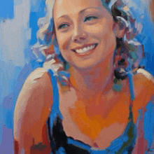 a woman in a blue tank top is smiling in a colorful painting