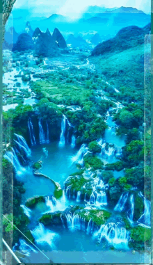 a waterfall in the middle of a lush green valley