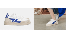 a pair of white and blue tennis shoes with the letter j on the side