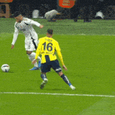 a soccer player wearing a yellow jersey with the number 3 on it kicks the ball