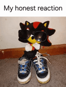 a shadow the hedgehog stuffed animal wearing sunglasses and a pair of shoes