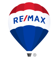 a red white and blue hot air balloon with the re / max logo on it