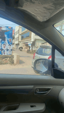 a car is parked in front of a sign that says ' shree '