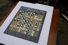 a board game called milton keynes is sitting on a wooden table