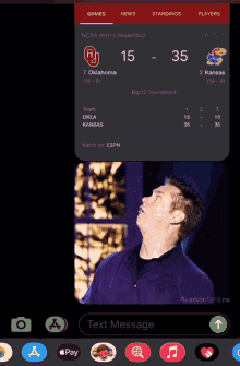 a phone screen shows a basketball game between oklahoma and kansas with the score 15-35