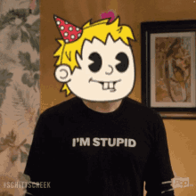 a man wearing a black shirt that says " i 'm stupid "