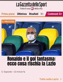 a man wearing a mask is sitting in a stadium with a lazio logo on his face