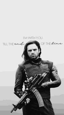 a black and white photo of a man holding a gun with the words i 'm with you till the end of the line below him