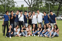 a group of young people posing for a picture with one of them wearing a shirt that says ' i love you '