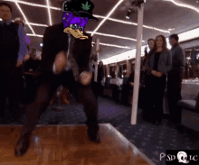 a man in a suit and tie is dancing with a duck on his head