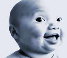 a baby making a funny face with his tongue out