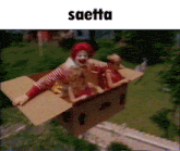 a picture of mcdonald 's flying in a cardboard box with two children