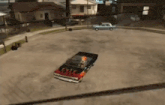 a black car with flames painted on the side is parked in a parking lot