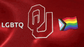 a red background with lgbtq and a rainbow flag