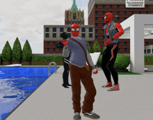 a man in a spiderman costume is standing next to another man