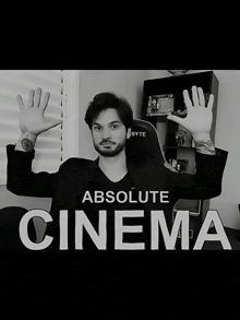 a black and white photo of a man with the words " absolute cinema " above him