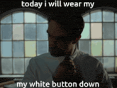 a man in a white shirt and tie is adjusting his tie with the caption today i will wear my white button down
