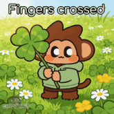 a cartoon monkey holding a four leaf clover with the words fingers crossed above him