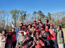 a group of people posing for a picture with one wearing a shirt that says ' ucsd '