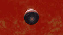 a red background with a black sphere on it