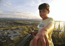 a young boy wearing a yellow shirt with a star on it