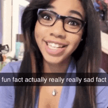 a woman wearing glasses and a blue shirt says fun fact actually really sad fact