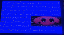 a blue screen with a picture of a red object in the center