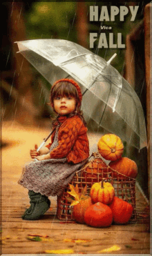 a little girl is sitting under an umbrella with pumpkins in the background and the words happy fall on the bottom