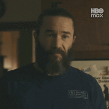 a man with a beard wearing a blue shirt that says right