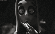 a black and white photo of a cartoon character with big eyes and a surprised look on his face .