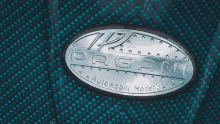 a pagani emblem is on a blue background