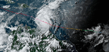 a satellite image of a hurricane with a red arrow pointing to the center