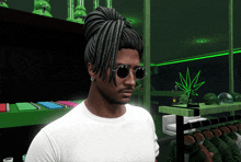 a man wearing sunglasses and dreadlocks stands in a store