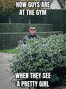 a man standing behind a bush with the caption how guys are at the gym