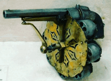 a close up of a gun with a flower design on the barrels